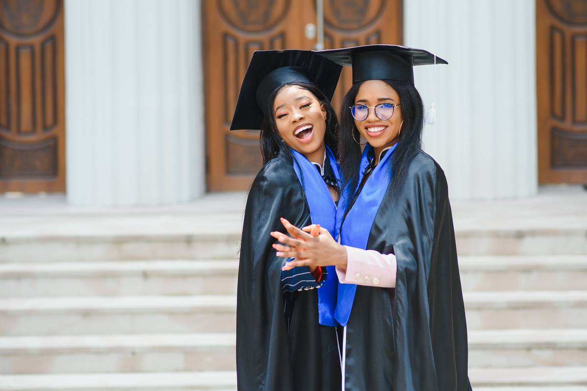 Graduates celebrating academic achievement at a college campus